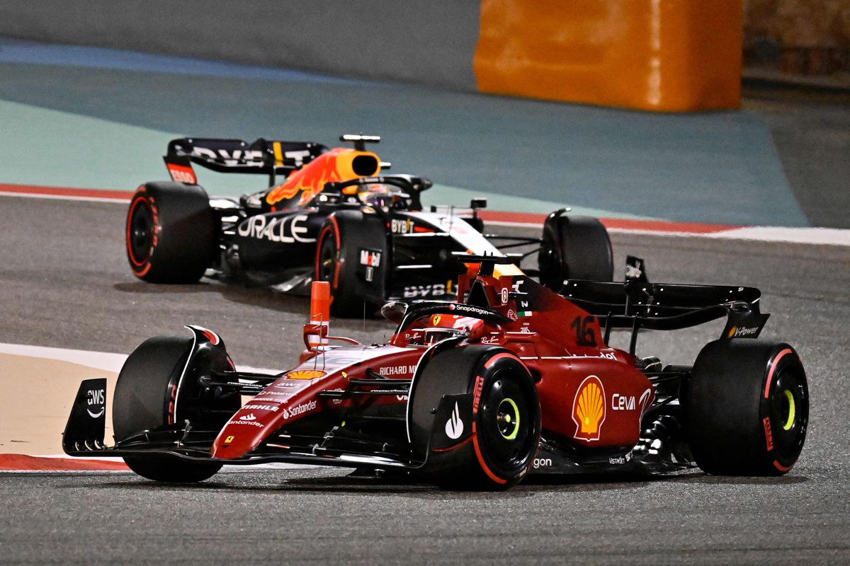 Ferrari’s Monegasque driver Charles Leclerc (foreground) and Red Bull’s Dutch driver Max Verstappen (background) compete during the Bahrain Formula One Grand Prix at the Bahrain International Circuit in the city of Sakhir on March 20, 2022.&nbsp;