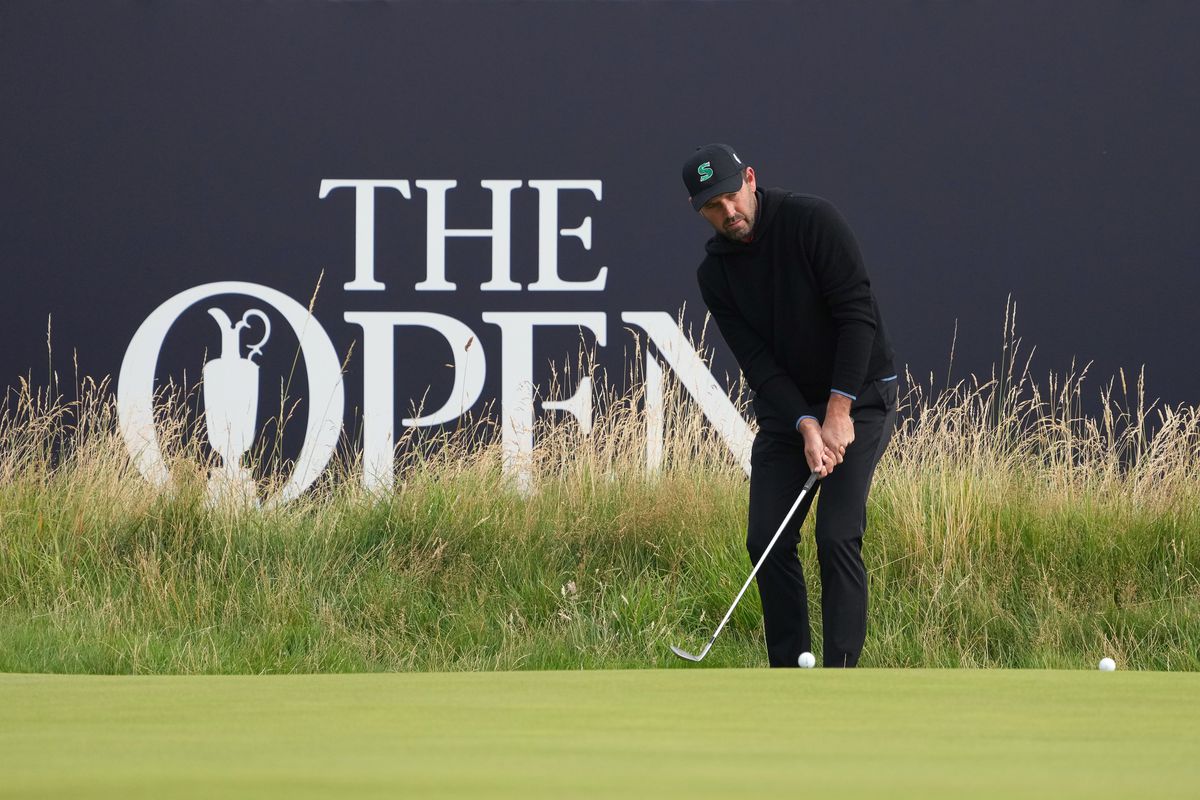 Charl Schwartzel plays a shot onto the third green during the first round of The Open Championship golf tournament at Royal Liverpool.