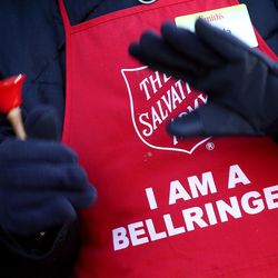 Angela Wilkins, an employee in Smith's floral department, rings a bell for the Salvation Army's red kettle campaign at a Smith's in Salt Lake City on Friday, Dec. 2, 2016. The Salvation Army is seeking volunteer bell ringers for the holiday season, and Smith's employees stepped up Friday, providing over 1,000 man hours standing at the kettles, which will save the Salvation Army roughly $9,000 in staffing costs. The Salvation Army is asking corporations, churches and families to volunteer and help differ the staffing costs and increase donations.