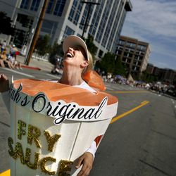 Kathy Finsand laughs as the crowd screams “We love fry sauce!” while marching with the South Jordan River Stake in the Days of ’47 Parade in Salt Lake City on July 24, 2009.