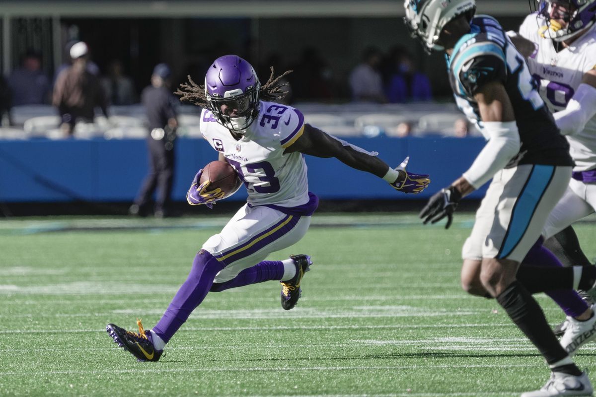 Minnesota Vikings running back Dalvin Cook (33) runs around end against the Carolina Panthers during the second half at Bank of America Stadium.