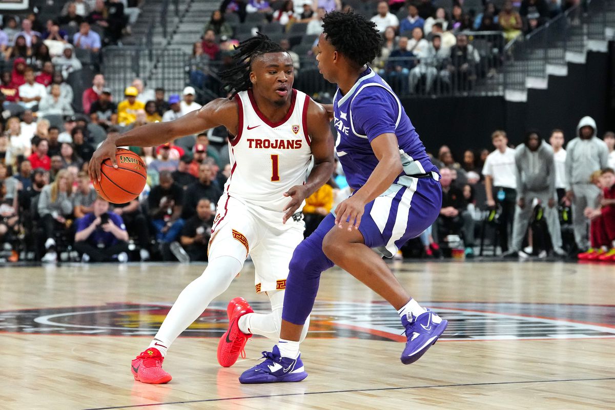 Nov 6, 2023; Las Vegas, Nevada, USA; USC Trojans guard Isaiah Collier (1) dribbles against Kansas State Wildcats guard Tylor Perry (2) during the first half at T-Mobile Arena. Mandatory Credit: Stephen R. Sylvanie