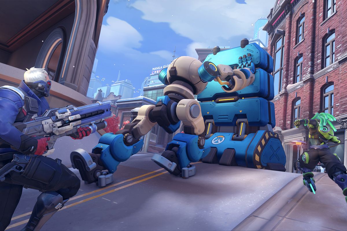 Overwatch heroes rally behind a large robot slowly pushing a huge device up a hill.