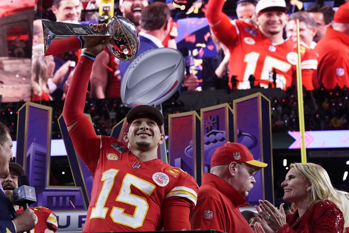 Kansas City Chiefs’ quarterback #15 Patrick Mahomes celebrates with the trophy after the Chiefs won Super Bowl LVIII against the San Francisco 49ers at Allegiant Stadium in Las Vegas, Nevada, February 11, 2024.