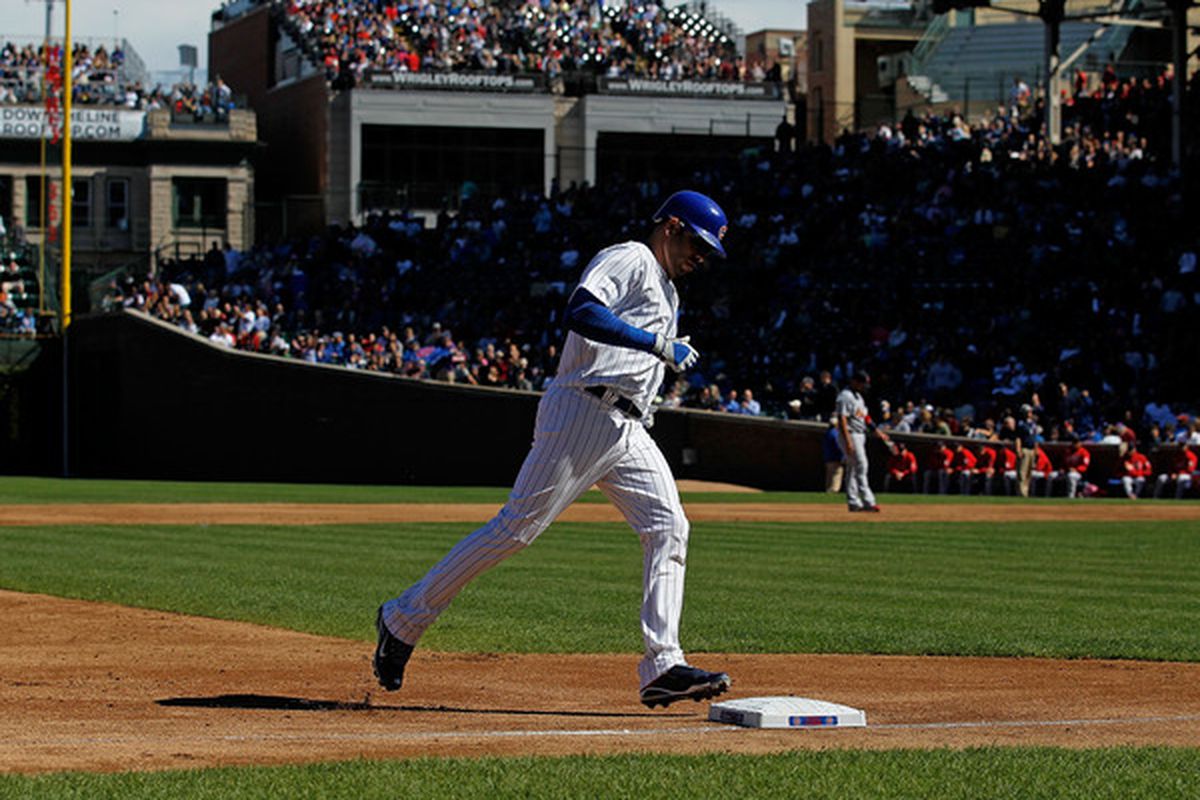 Aramis Ramirez of the Chicago Cubs touches third base after hitting a solo home run in the 2nd inning against the St. Louis Cardinals at Wrigley Field in Chicago Illinois. (Photo by Jonathan Daniel/Getty Images)
