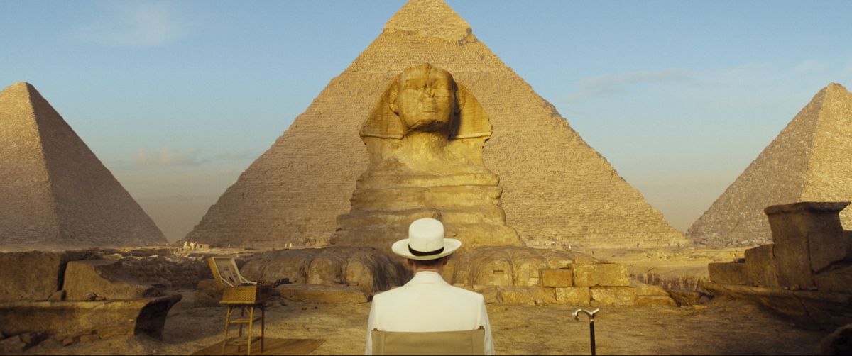 Kenneth Branagh as Hercule Poirot observes the Sphinx in Death on the Nile.