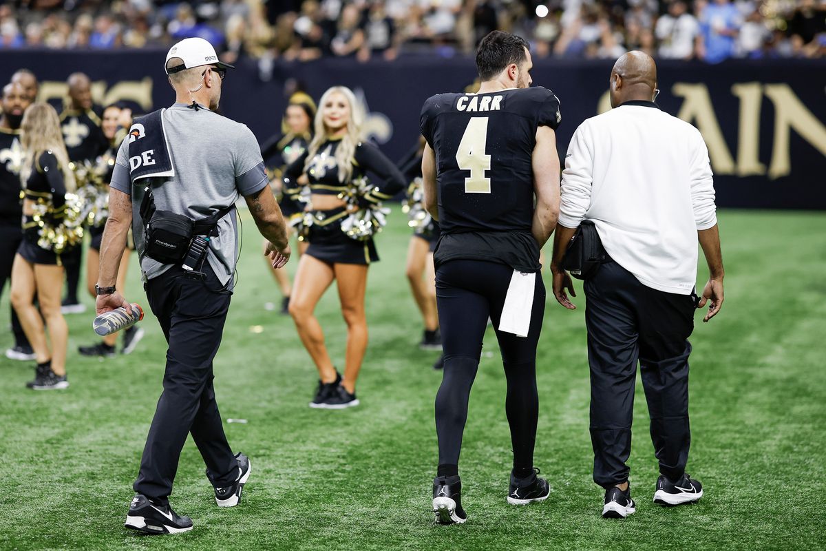 Derek Carr #4 of the New Orleans Saints walks off the field after being injured in the fourth quarter against the Detroit Lions at the Caesars Superdome on December 03, 2023 in New Orleans, Louisiana.