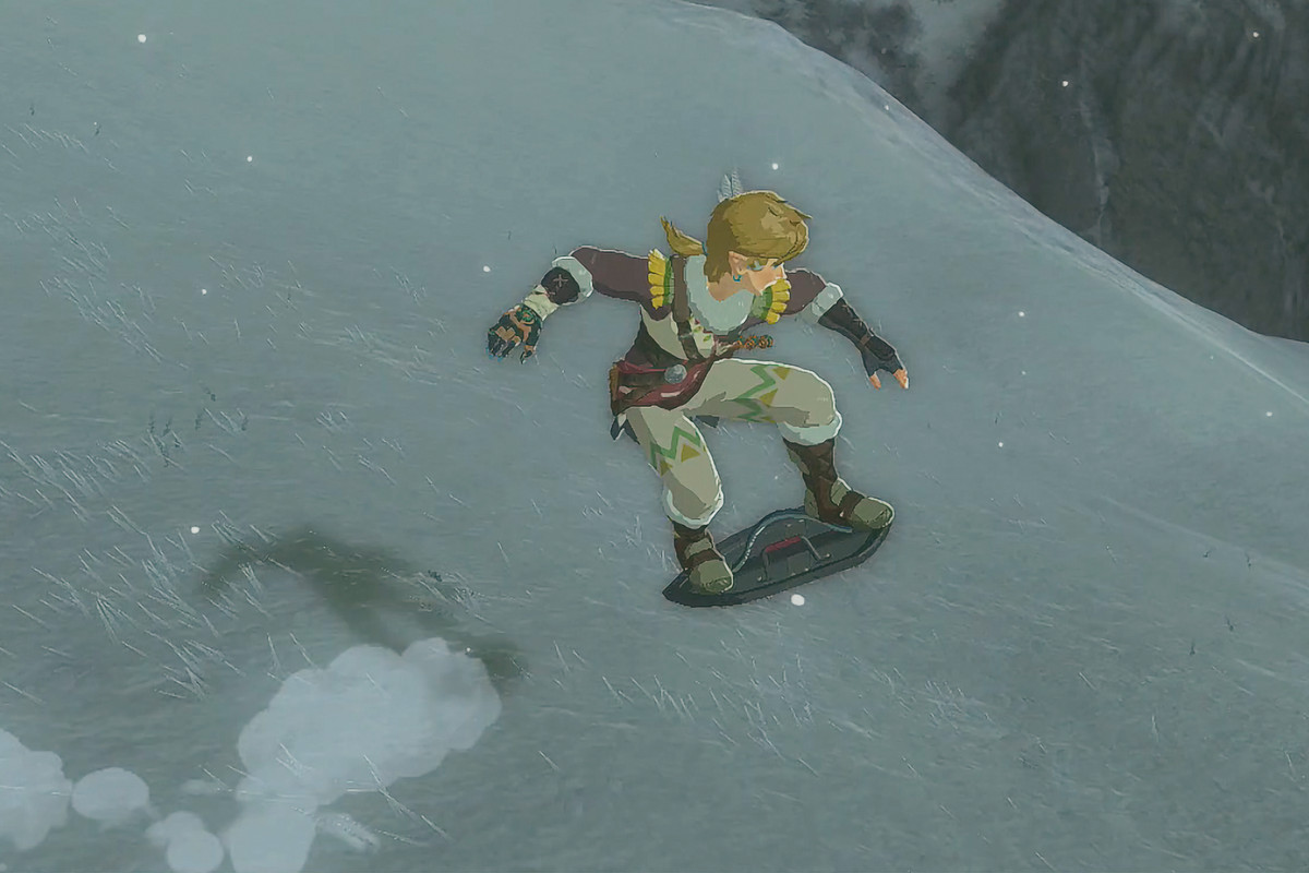 Link shield surfs down a snowy mountain in Zelda Tears of the Kingdom.