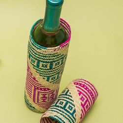 Mexican hand-woven wine cover, $20 at <a href="https://www.loveadorned.com/">Love Adorned</a>