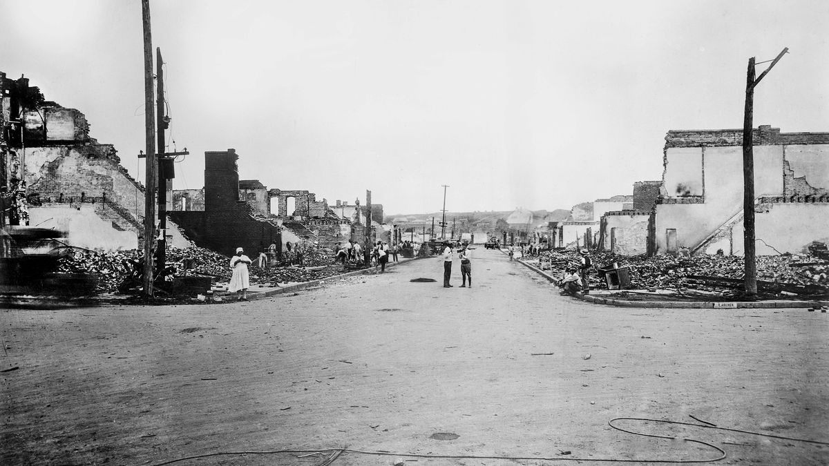 An intersection of two streets in Tulsa showing burned-out houses.