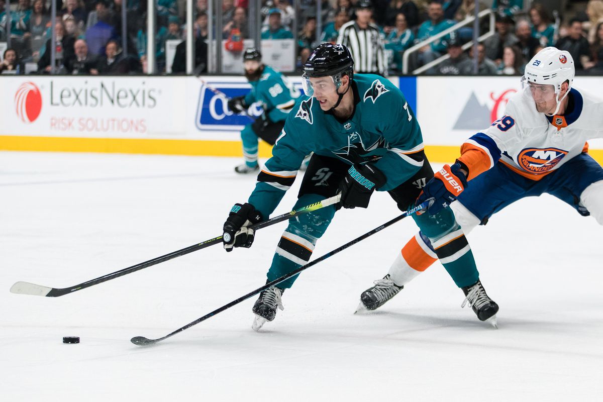 Nov 23, 2019; San Jose, CA, USA; San Jose Sharks center Dylan Gambrell (7) and New York Islanders center Brock Nelson (29) battle for possession in the second period at SAP Center at San Jose