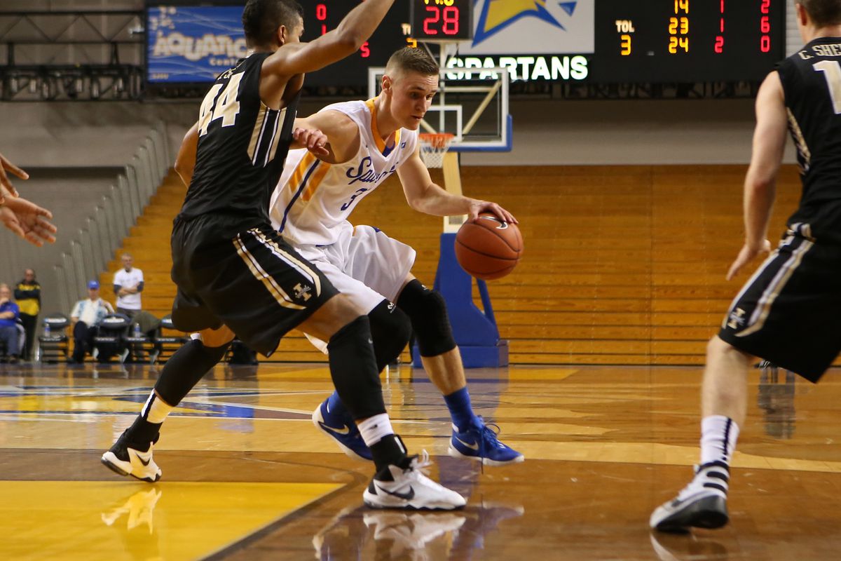 Ryan Welage (in white) drives to the basket in first game as a collegiate    