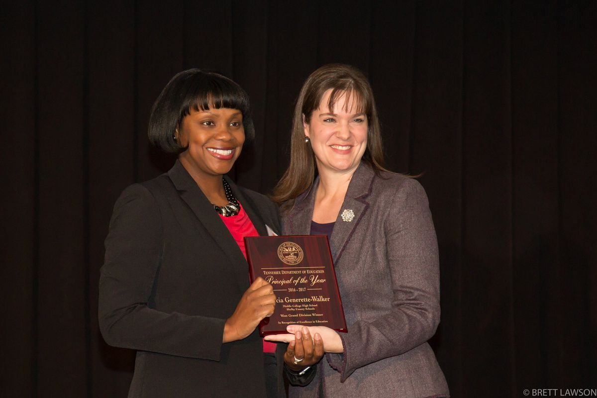 From left: Docia Generette-Walker receives Tennessee's 2016 principal of the year honor from Education Commissioner Candice McQueen. Generette-Walker leads Middle College High School in Memphis.