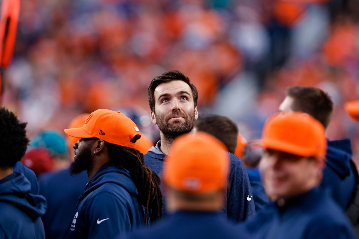 Denver Broncos quarterback Joe Flacco looks up from the sidelines in the third quarter against the Detroit Lions at Empower Field at Mile High.