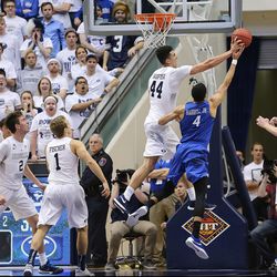 Brigham Young Cougars center Corbin Kaufusi (44) blocks a shot by Creighton Bluejays guard Ronnie Harrell Jr. (4) as BYU and Creighton play in NIT quarterfinal action at the Marriott Center in Provo Tuesday, March 22, 2016.