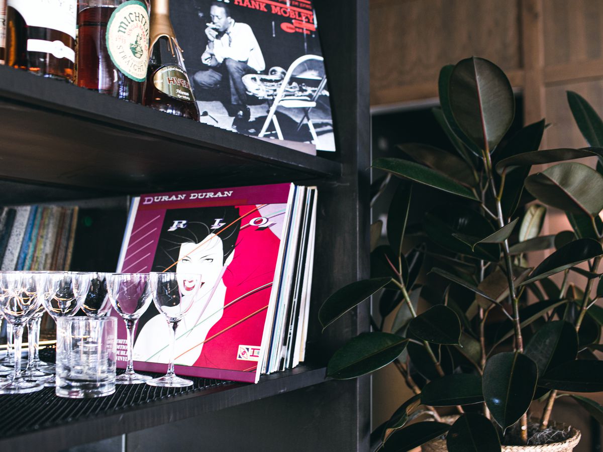 Records like Duran Duran’s “Rio” and Frank Mobley are stacked on the shelves along the back bar among the glasses and liquor bottles at Lyla Lila in Midtown.