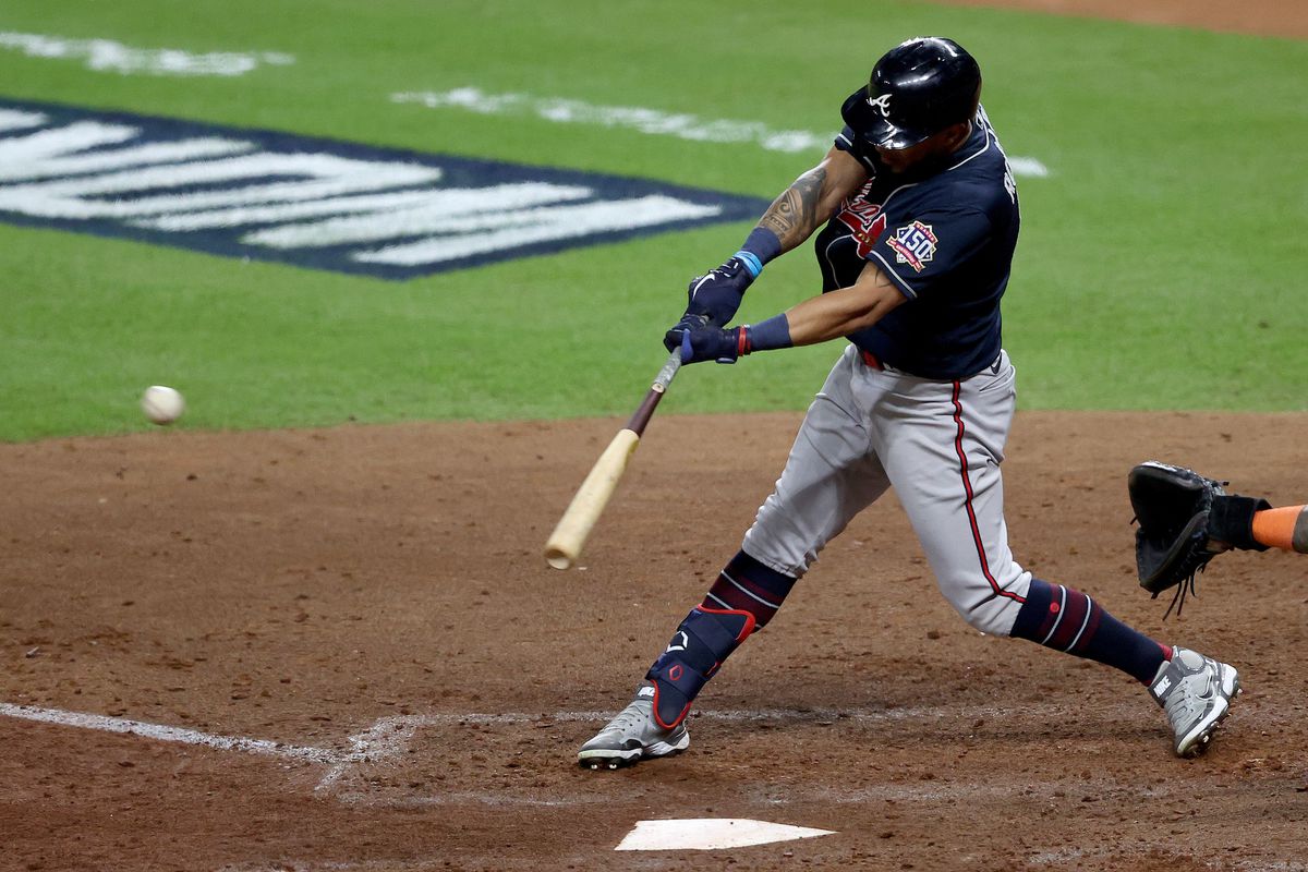 Eddie Rosario #8 of the Atlanta Braves hits a double against the Houston Astros during the seventh inning in Game One of the World Series at Minute Maid Park on October 26, 2021 in Houston, Texas.