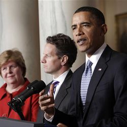 President Barack Obama delivers a statement on his budget that he sent to Congress, Monday,  in the Grand Foyer of the White House in Washington. From left are, Council of Economic Council Chair Christina Romer, Treasury Secretary Timothy Geithner and the president. 