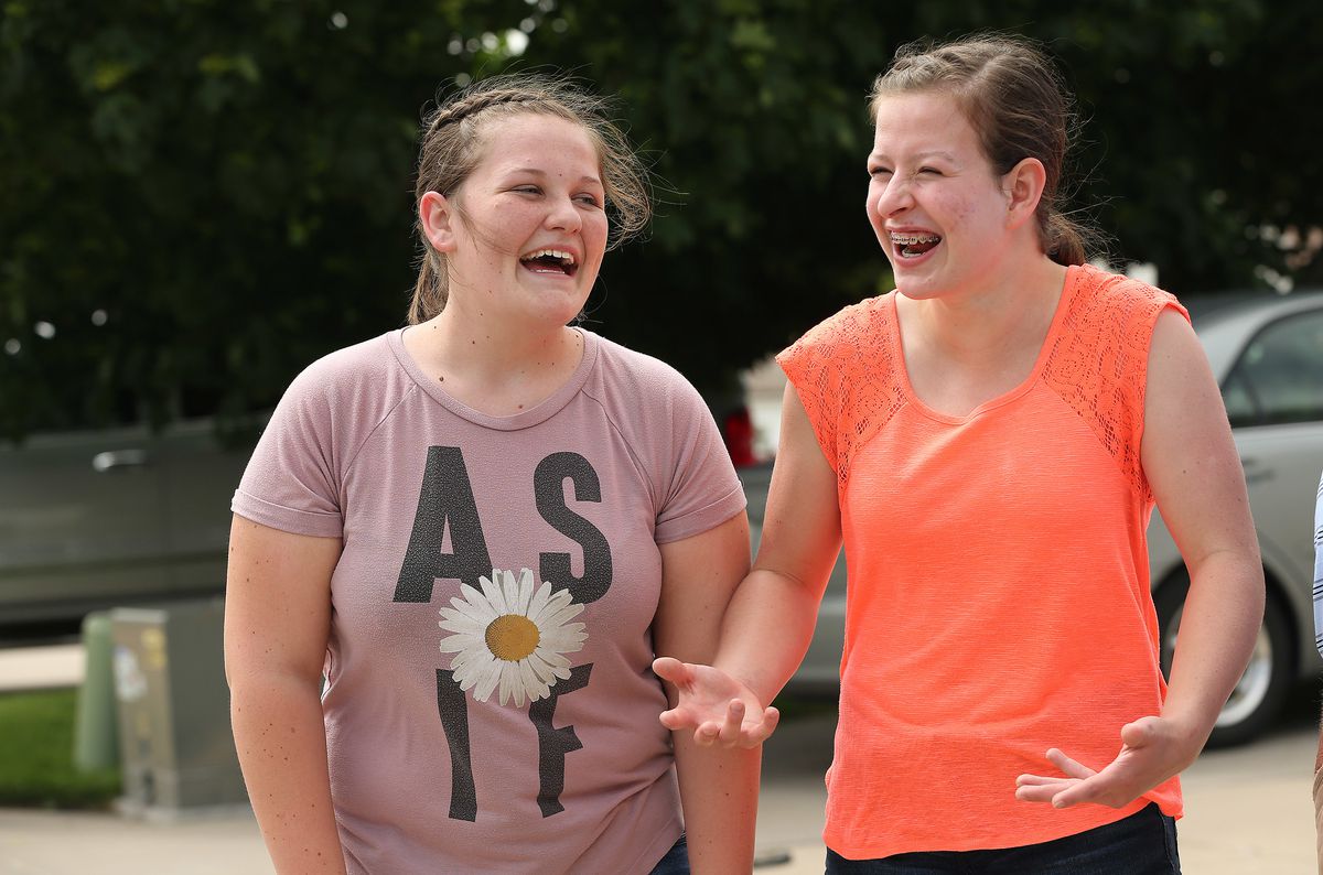 Morgan Selleneit, right, laughs with her friend Macee Silvester at her home in Centerville on Thursday, May 31, 2018. Morgan is 15 and uses her phone around 3 hours a day, mostly on Instagram and Snapchat.