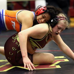 Taimane Fiatoa of Timpview takes Jesse Harrison of Maple Mountain down as they wrestle in the 160 weight class at the 5A/3A/2A/1A girls wrestling state championship meet at Mountain View High School in Orem on Wednesday, Feb. 17, 2021.
