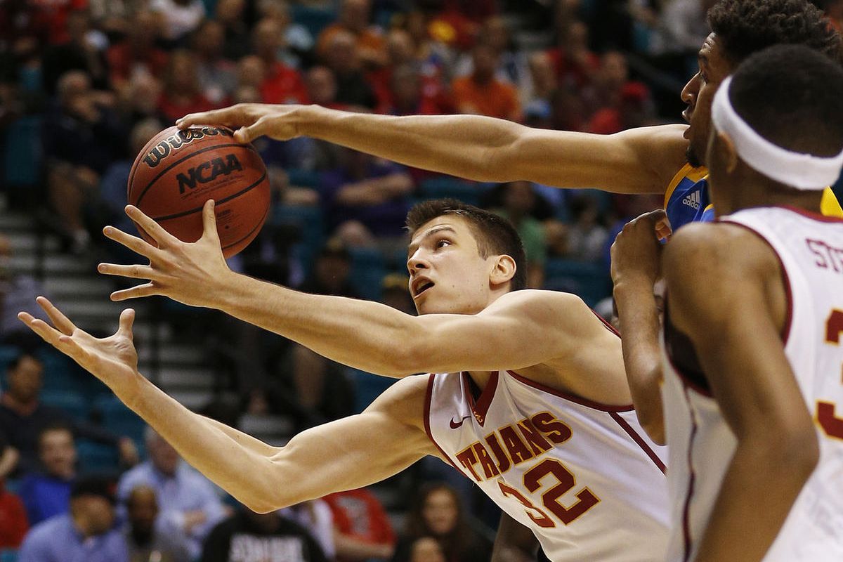 Southern California forward Nikola Jovanovic (32) reaches for the ball during the first half of the team's NCAA college basketball game against UCLA in the first round of the Pac-12 men's tournament Wednesday, March 9, 2016, in Las Vegas. (AP Photo/John L