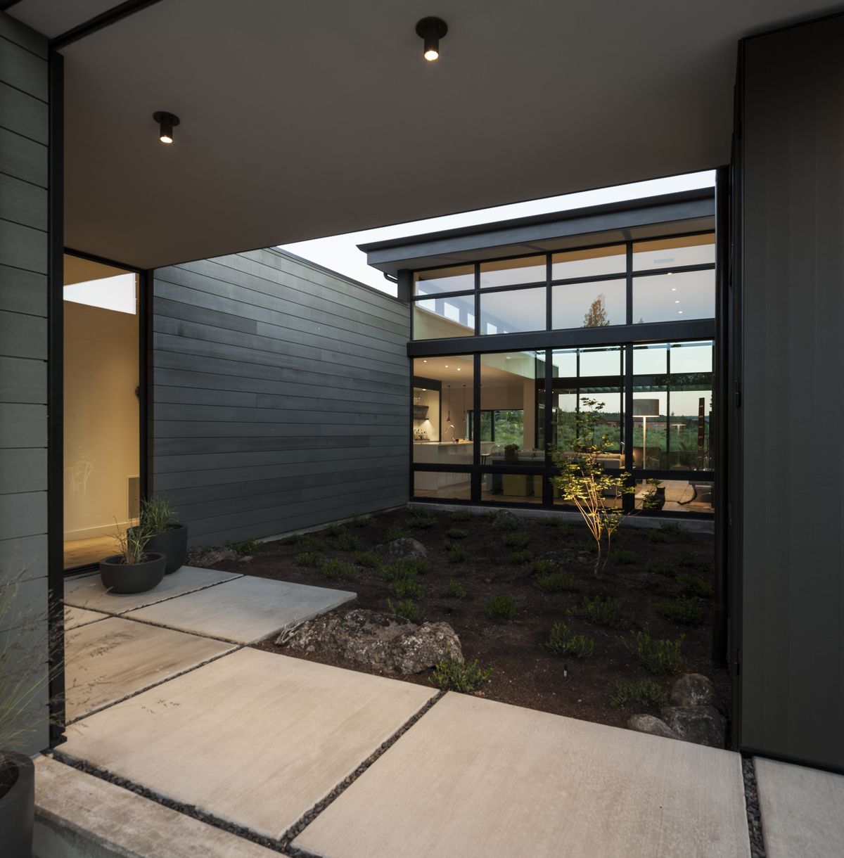 Courtyard of modern house with concrete path