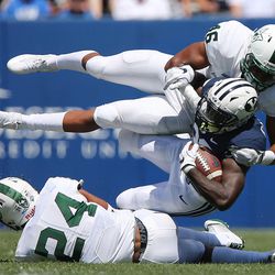 Brigham Young Cougars running back Squally Canada (22) is brought down by Portland State Vikings linebacker Kasun Jackett (46)  in Provo on Saturday, Aug. 26, 2017. BYU won 20-6.