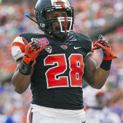 Oregon State running back Terron Ward (28) celebrates after scoring a touchdown in the second quarter of the Hawaii Bowl NCAA college football game against Boise State, in Honolulu, Tuesday, Dec. 24, 2013. 