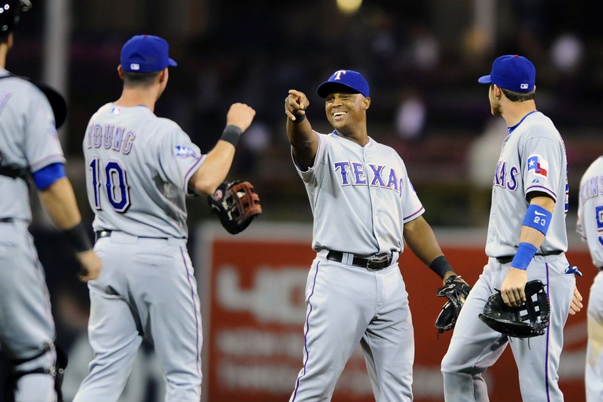 June 18, 2012; San Diego, CA, USA; Texas Rangers third baseman Adrian Beltre (middle) celebrates with teammates following a 2-1 win against the San Diego Chargers at Petco Park.  Mandatory Credit: Christopher Hanewinckel-US PRESSWIRE
