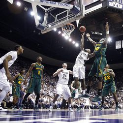 BYU's #1 Charles Abouo tries to push the ball back up at the hoop as BYU and Baylor play Saturday, Dec. 17, 2011 in the Marriott Center in Provo. Baylor won 86-83.