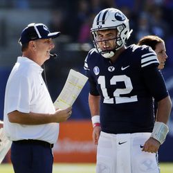 BYU offensive coordinator and quarterbacks coach Ty Detmer talks with quarterback Tanner Mangum during game against San Jose State in Provo on Saturday, Oct. 28, 2017.