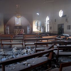 The damaged interior of the holy family Syrian Catholic Church after an early morning car bomb attack in Kirkuk, 180 miles north of Baghdad, Iraq, Tuesday, Aug. 2, 2011. More than 10 people were injured in the attack, police said.