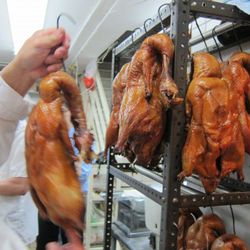 Chef Wu shows us a batch of birds that just came out of the oven. 