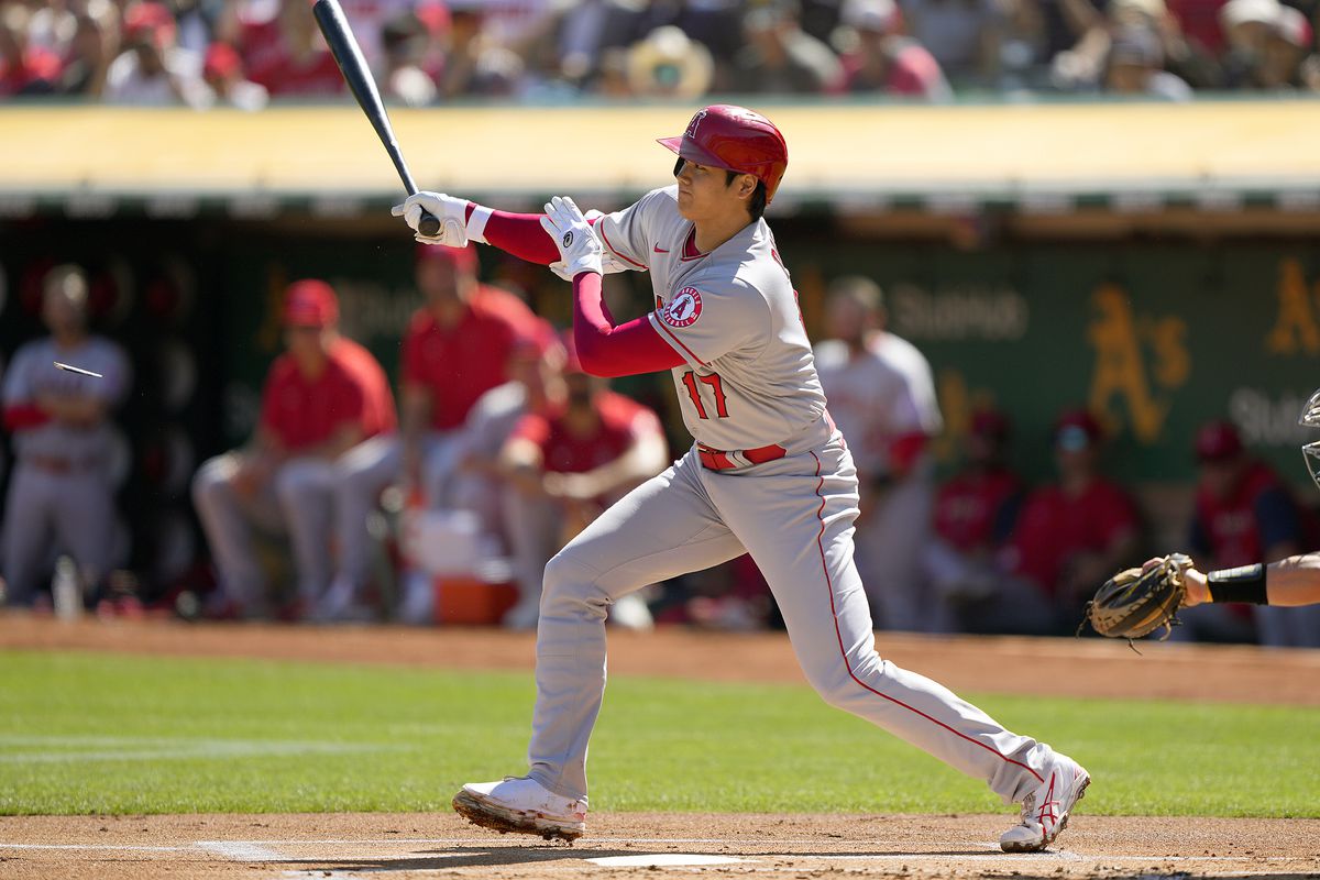 Shohei Ohtani #17 of the Los Angeles Angels hits a single against the Oakland Athletics in the top of the first inning at RingCentral Coliseum on October 05, 2022 in Oakland, California.