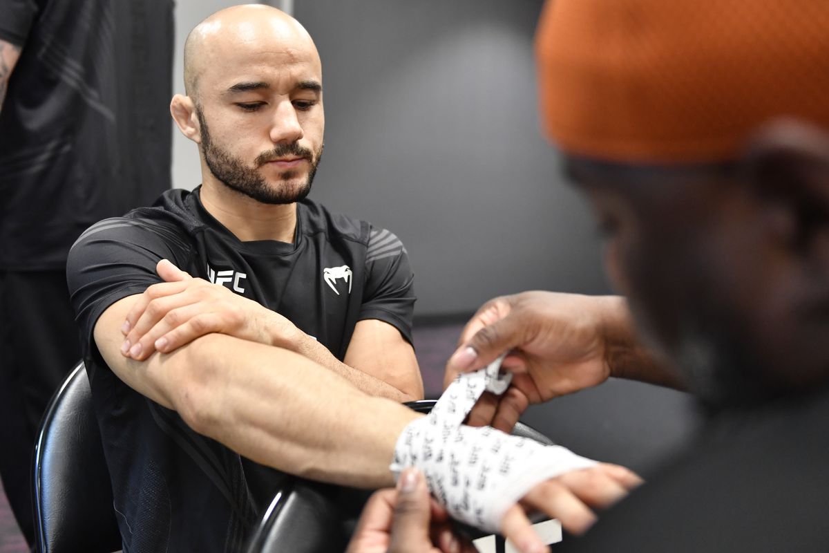 Marlon Moraes getting his hands wrapped backstage before UFC 266. 