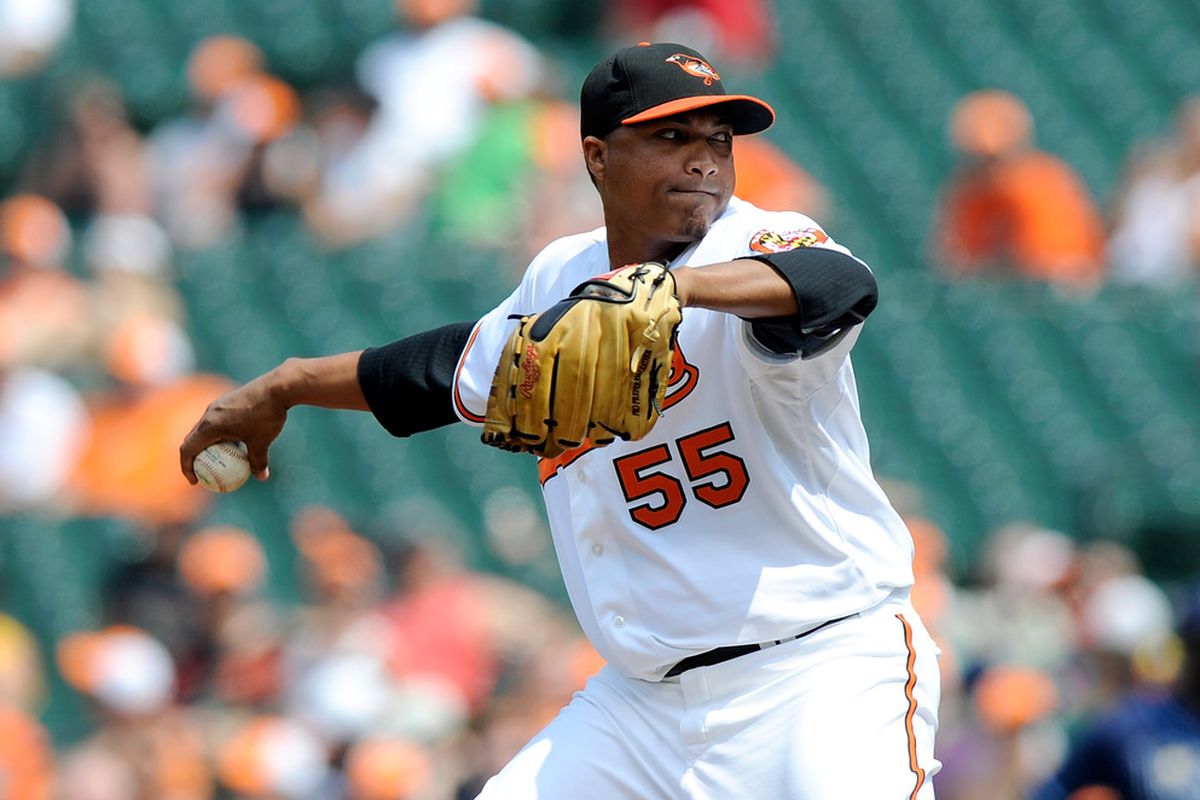 BALTIMORE, MD - JUNE 12:  Alfredo Simon #55 of the Baltimore Orioles pitches against the Tampa Bay Rays at Oriole Park at Camden Yards on June 12, 2011 in Baltimore, Maryland.  (Photo by Greg Fiume/Getty Images)
