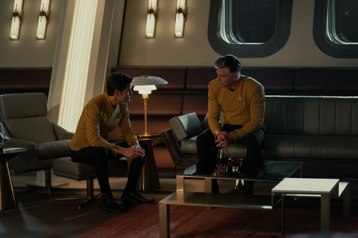 Kirk (Paul Wesley) sitting and talking to Pike (Anson Mount) in the captain’s quarters