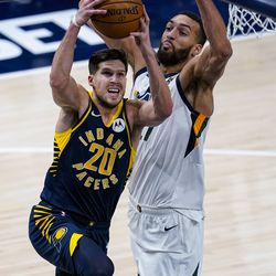 Indiana Pacers forward Doug McDermott (20) shoots in front of Utah Jazz center Rudy Gobert (27) during the second half of an NBA basketball game in Indianapolis, Sunday, Feb. 7, 2021.