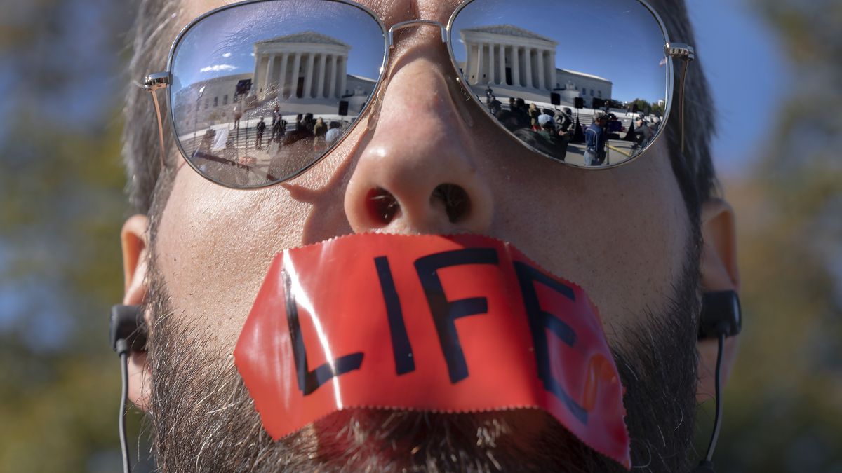 A pro-life activist attends a rally outside the Supreme Court. 