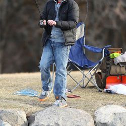 Easton Monsen braves the cold temperatures Sunday, Feb. 22, 2015, as he fishes at the pond at Herriman Springs.