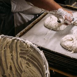 Spreading meringue rounds.