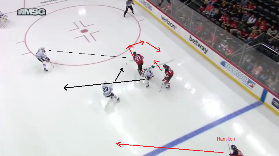 Zacha collects the puck and will turn for an option around a screen set by Bratt.  Hamilton will gain the zone soon.