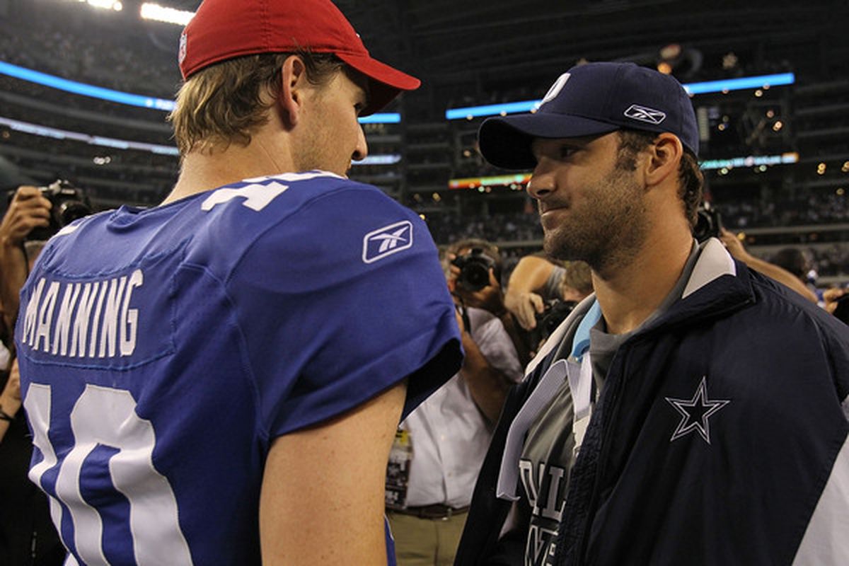ARLINGTON TX - OCTOBER 25:  Quarterback Tony Romo #9 of the Dallas Cowboys talks with Eli Manning #10 of the New York Giants after a game at Cowboys Stadium on October 25 2010 in Arlington Texas.  (Photo by Ronald Martinez/Getty Images)