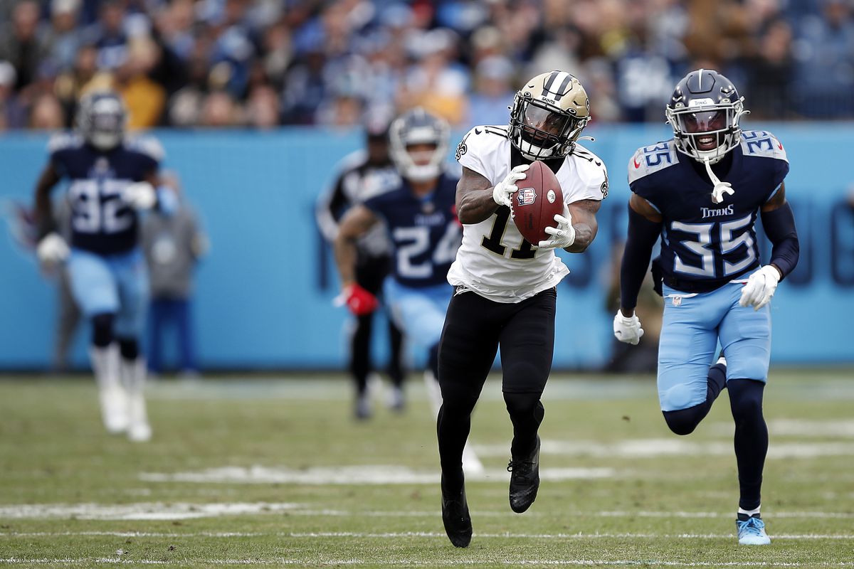 Deonte Harris #11 of the New Orleans Saints makes a catch against Chris Jackson #35 of the Tennessee Titans in the second quarter at Nissan Stadium on November 14, 2021 in Nashville, Tennessee.