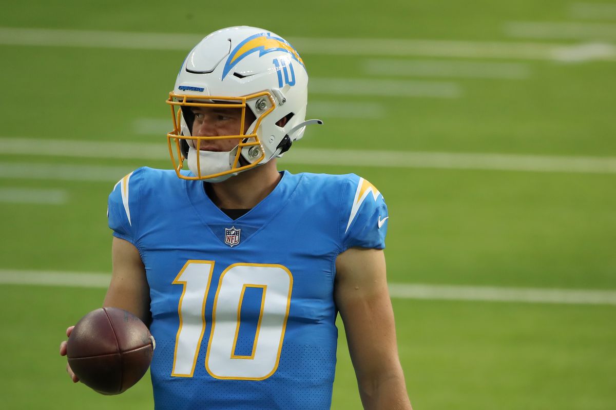 Justin Herbert #10 of the Los Angeles Chargers looks on during warm ups before the game against the New England Patriots at SoFi Stadium on December 06, 2020 in Inglewood, California.