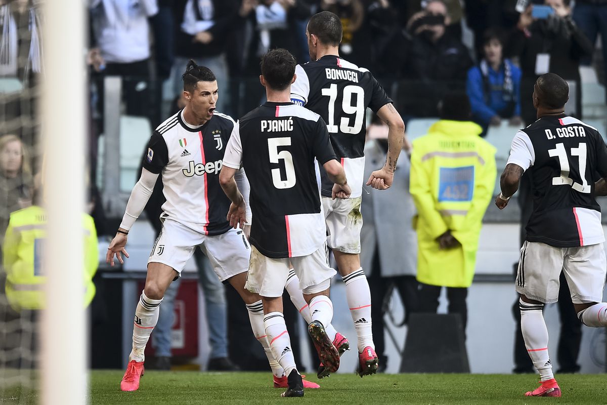 Cristiano Ronaldo (L) of Juventus FC celebrates after...