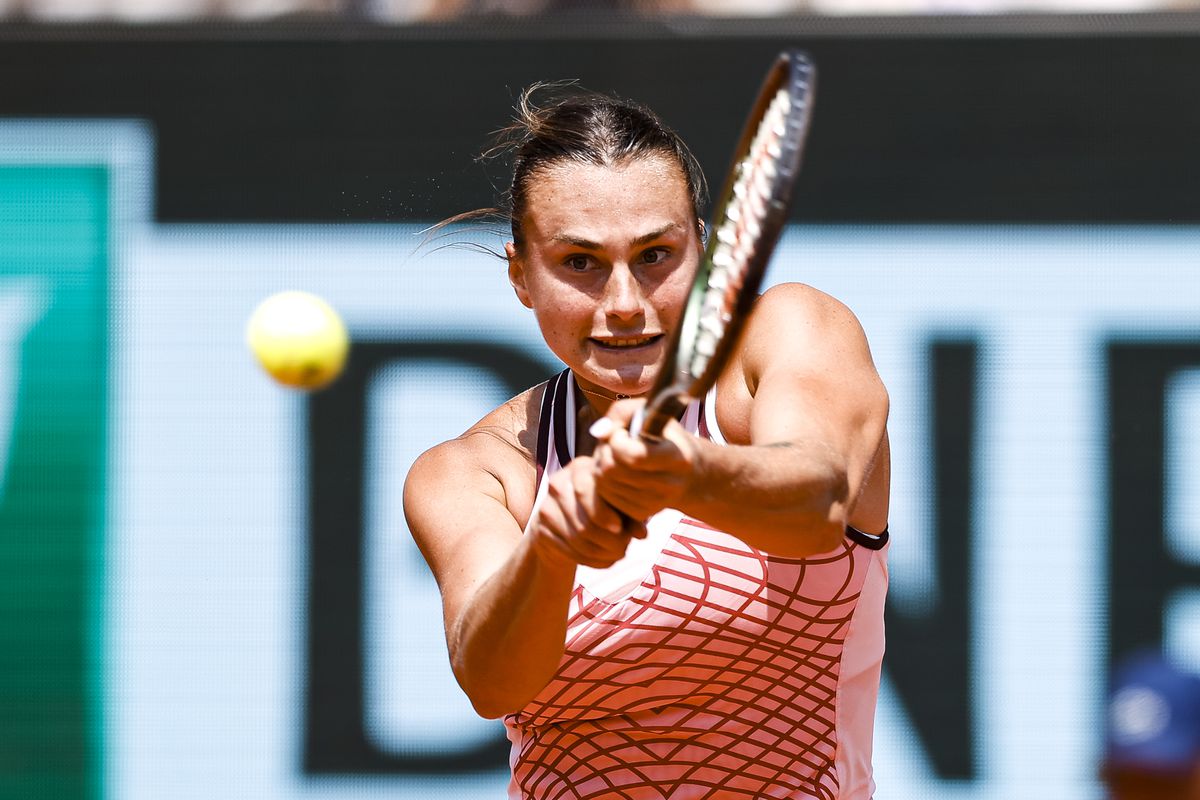 Aryna Sabalenka plays a backhand against Elina Svitolina of Ukraine during the Singles Quarter Final match on Day Ten of the 2023 French Open at Roland Garros on June 6, 2023 in Paris, France.