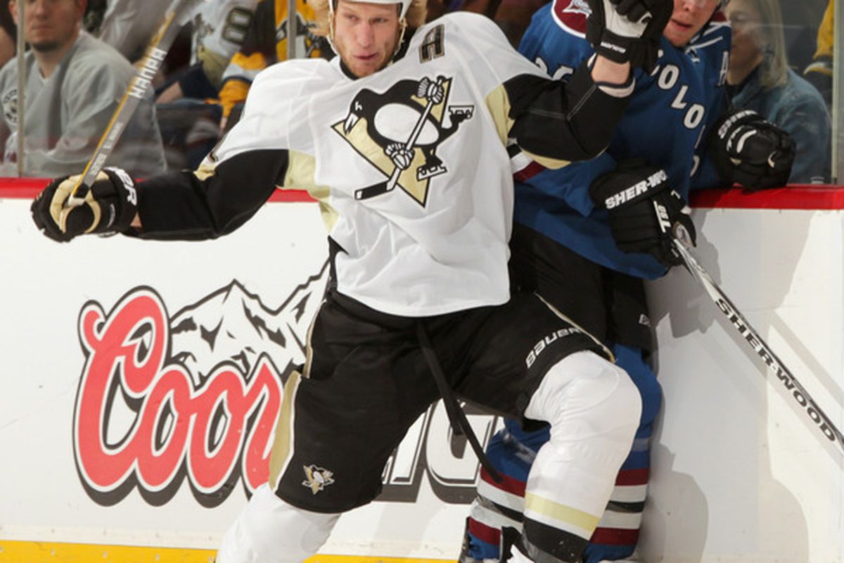 DENVER CO - FEBRUARY 16:  Jordan Staal #11 of the Pittsburgh Penguins puts a hit on Paul Stastny #26 of the Colorado Avalanche at the Pepsi Center on February 16 2011 in Denver Colorado.  (Photo by Doug Pensinger/Getty Images)