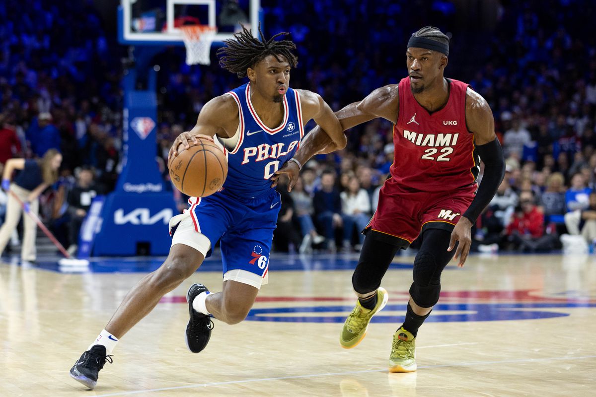 Philadelphia 76ers guard Tyrese Maxey (0) dribbles the ball against Miami Heat forward Jimmy Butler (22) during the third quarter in game three of the second round for the 2022 NBA playoffs at Wells Fargo Center.