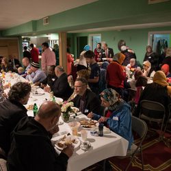 People eat lunch after a ceremony marking the completion of renovations of the Islamic Society of Bosniaks mosque in Salt Lake City on Saturday, Dec. 10, 2016. The mosque, which serves the area's Bosnian Muslim community, is named Maryam after the mother of Jesus.